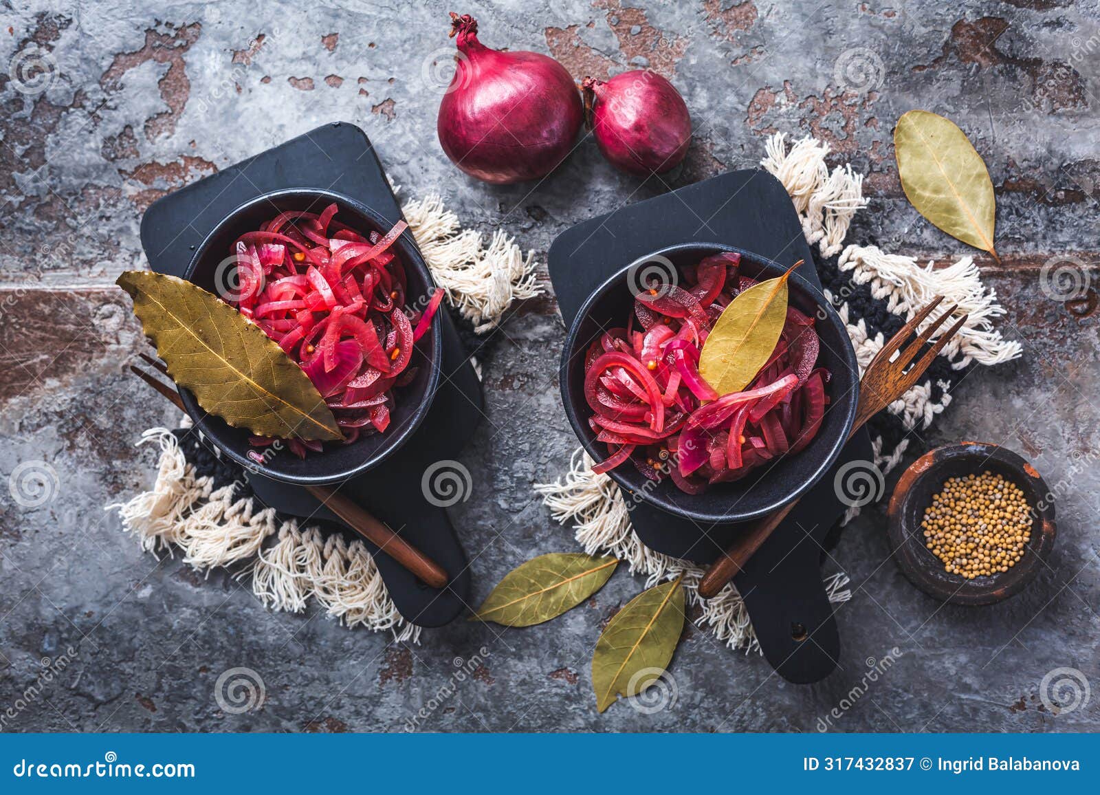 pickled red onions in bowl on a gray background. appetizer, condiment or topping, healthy fermented food