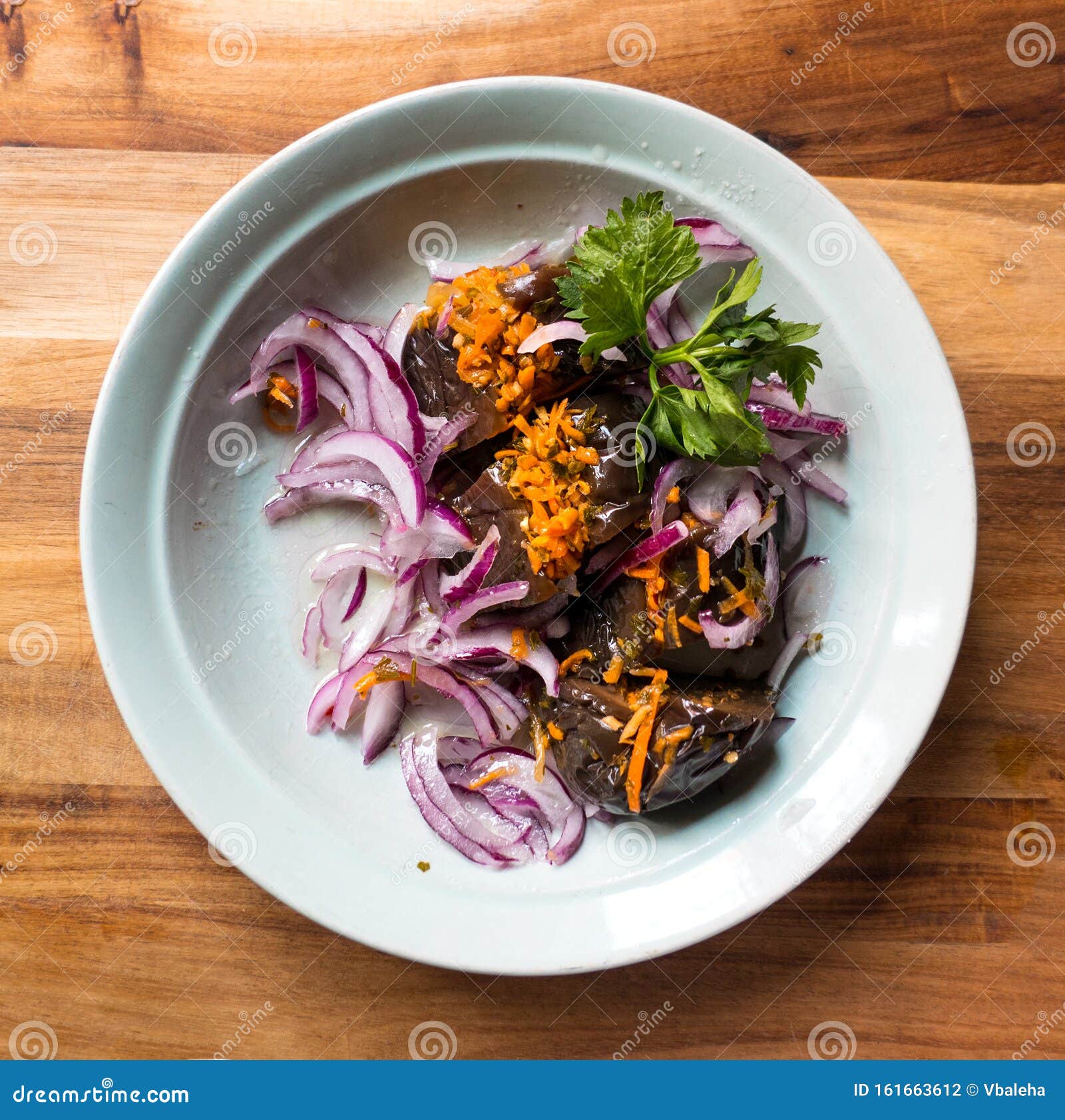 Pickled Stuffed Eggplant with Vegetables in a Plate Stock Photo Image