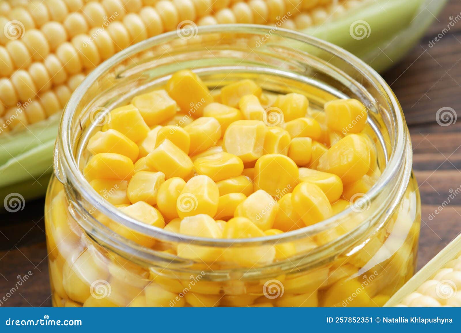 Pickled Sweet Corn in Glass Jar, Fresh and Cooked Corn on Cobs Stock