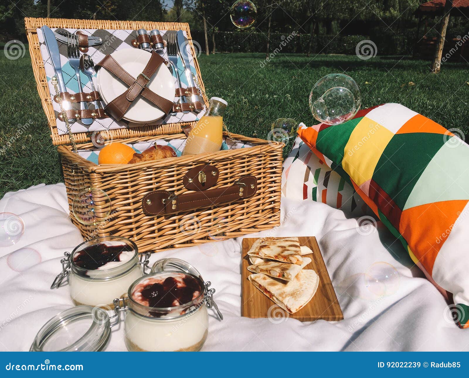 Picnic Basket Food on Blanket and Soap Bubbles Stock Image Image of