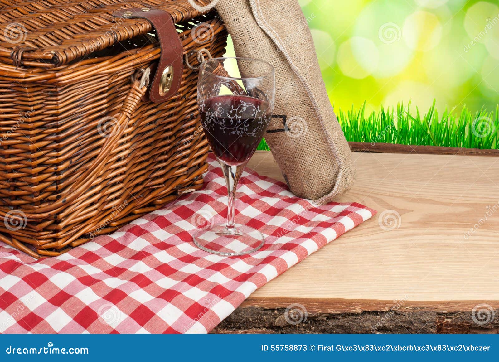 Picnic Basket on the Table and Bottle of Wine Top Angle Stock Image