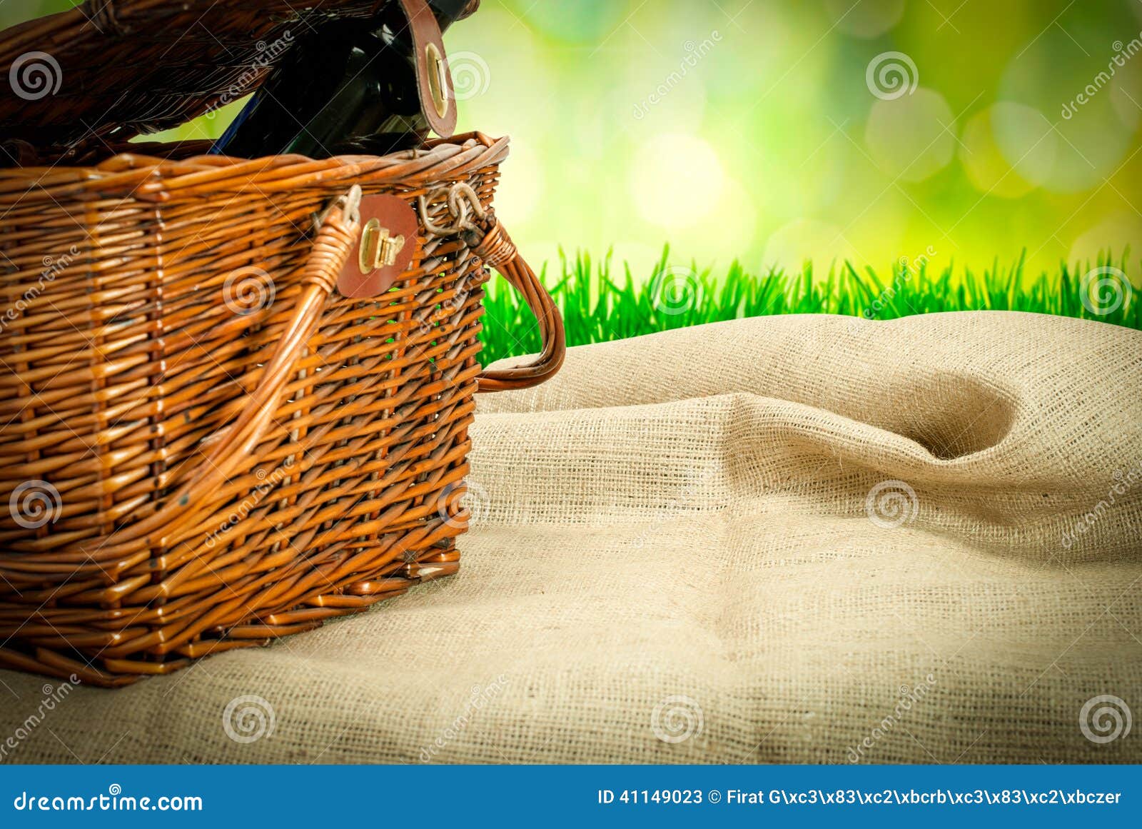 Picnic Basket And Wine Botle On The Table With Sack Cloth Stock Image