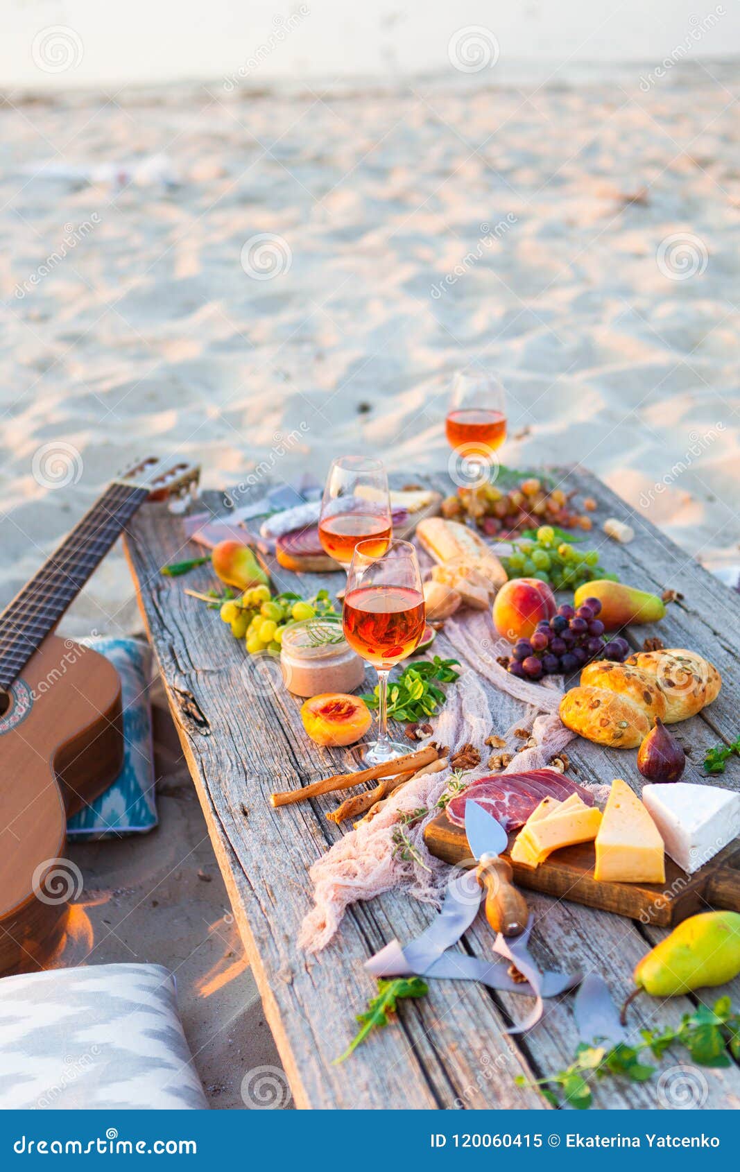 Picnic on Beach at Sunset in Boho Style. Romantic Dinner, Friend