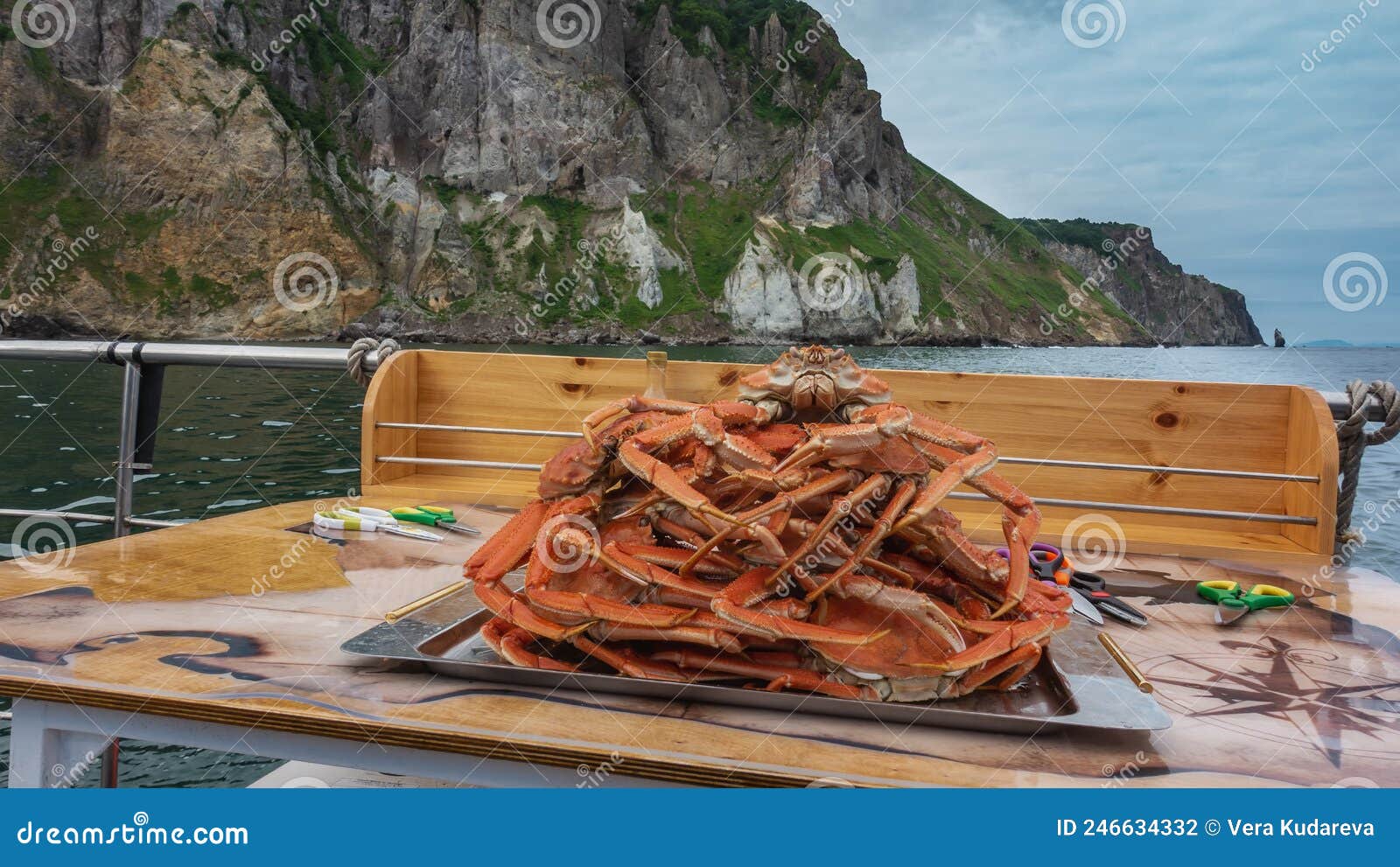picnic on the yacht. freshly brewed snow crabs are piled up