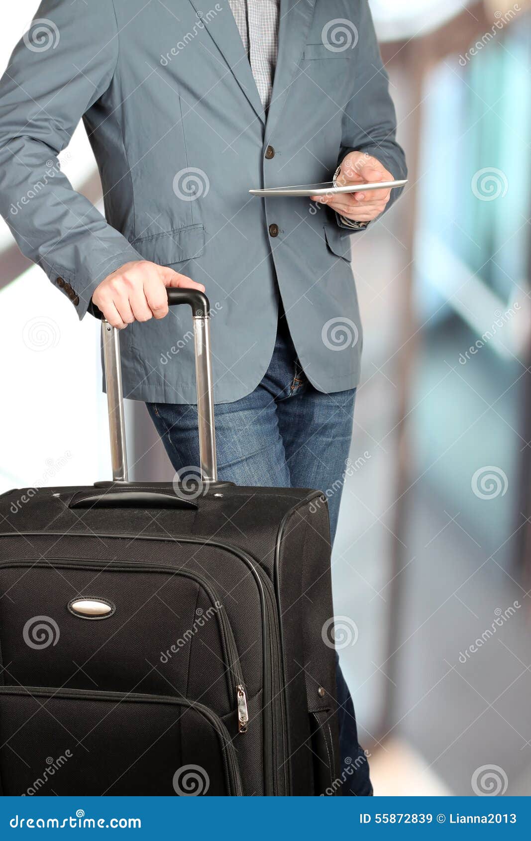 Picture of a Close Up Man Using a Digital Tablet with Baggage Be Stock