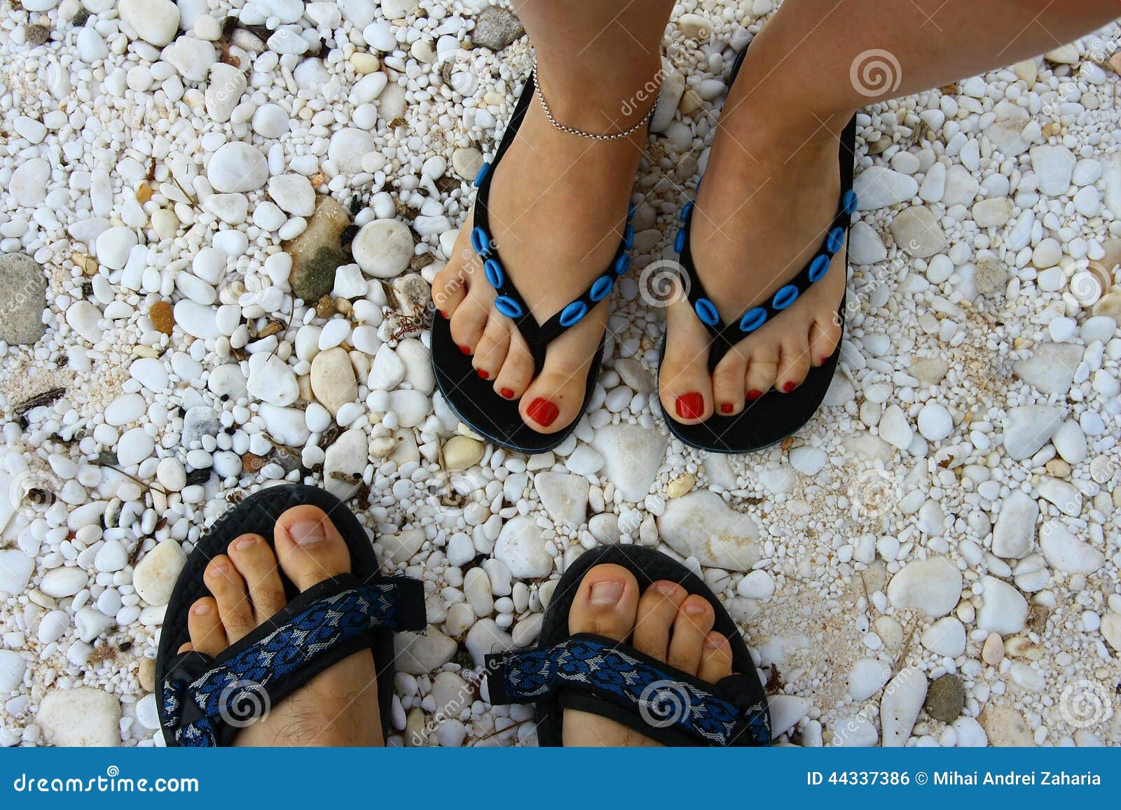 Picture of Couples Feet in Slippers on Beach Stock Photo - Image of ...