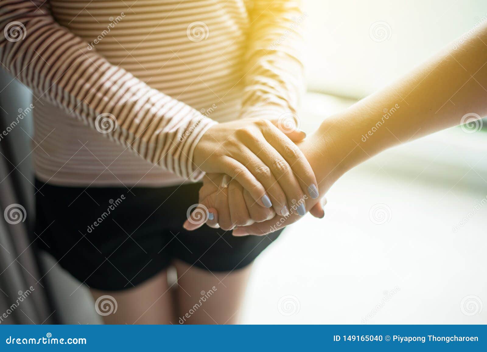 picture of couple women friends holding hands and caring supporting comforting together,encouragement concept