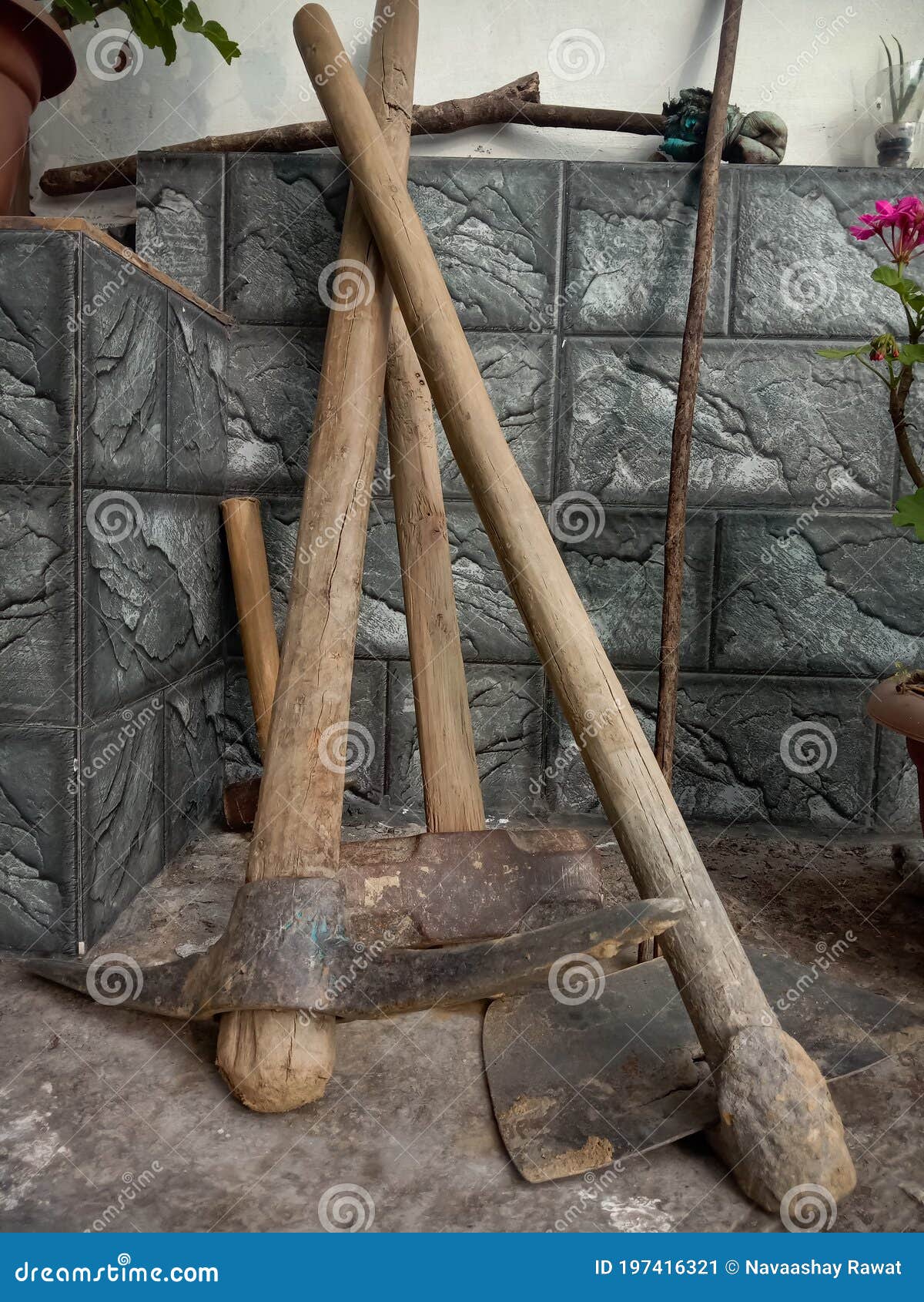 Picture of Different Tools. Mattock, Hoe, Cross Peen Hammer, Stone