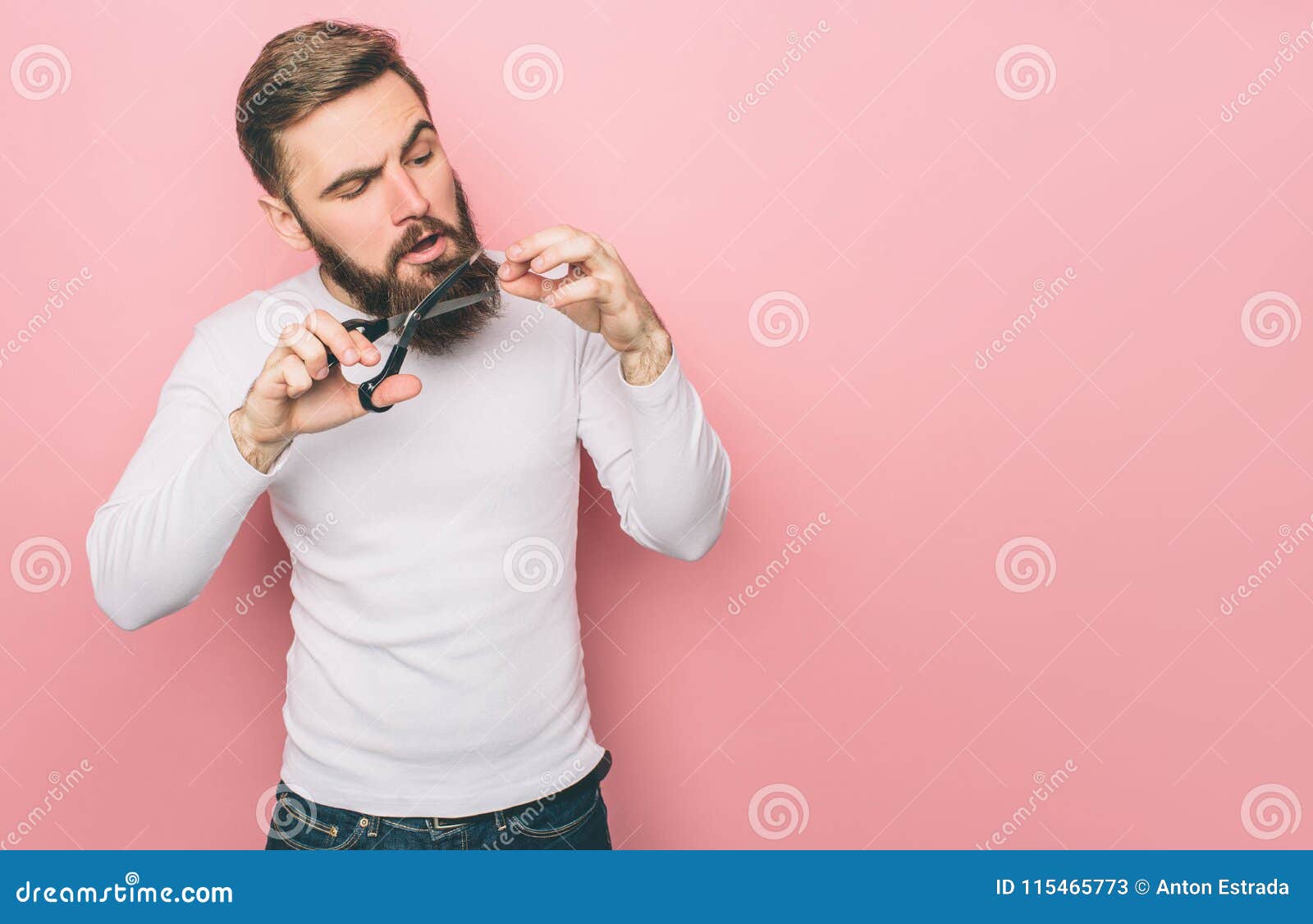 A Picture of Guy that Cuts His Beard with the Scissors. he is Doing ...