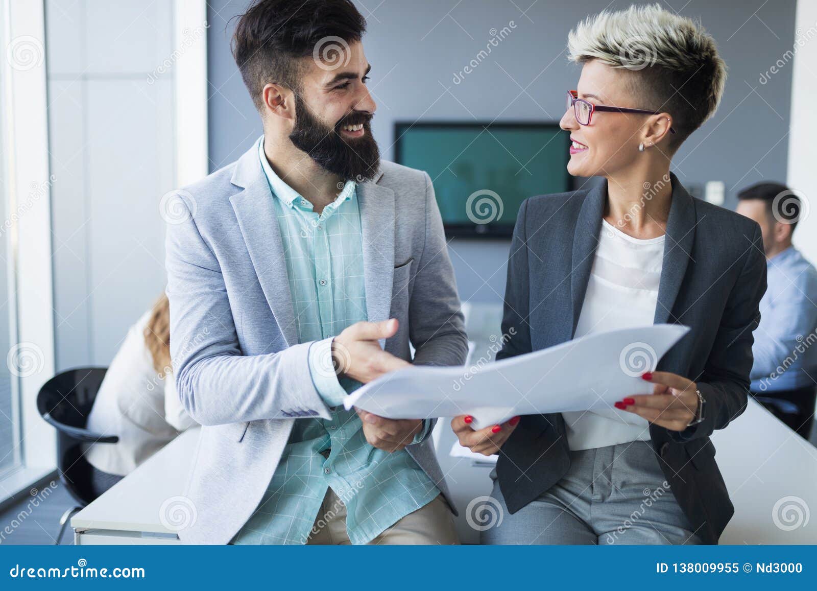 picture of handsome man and woman as business partners