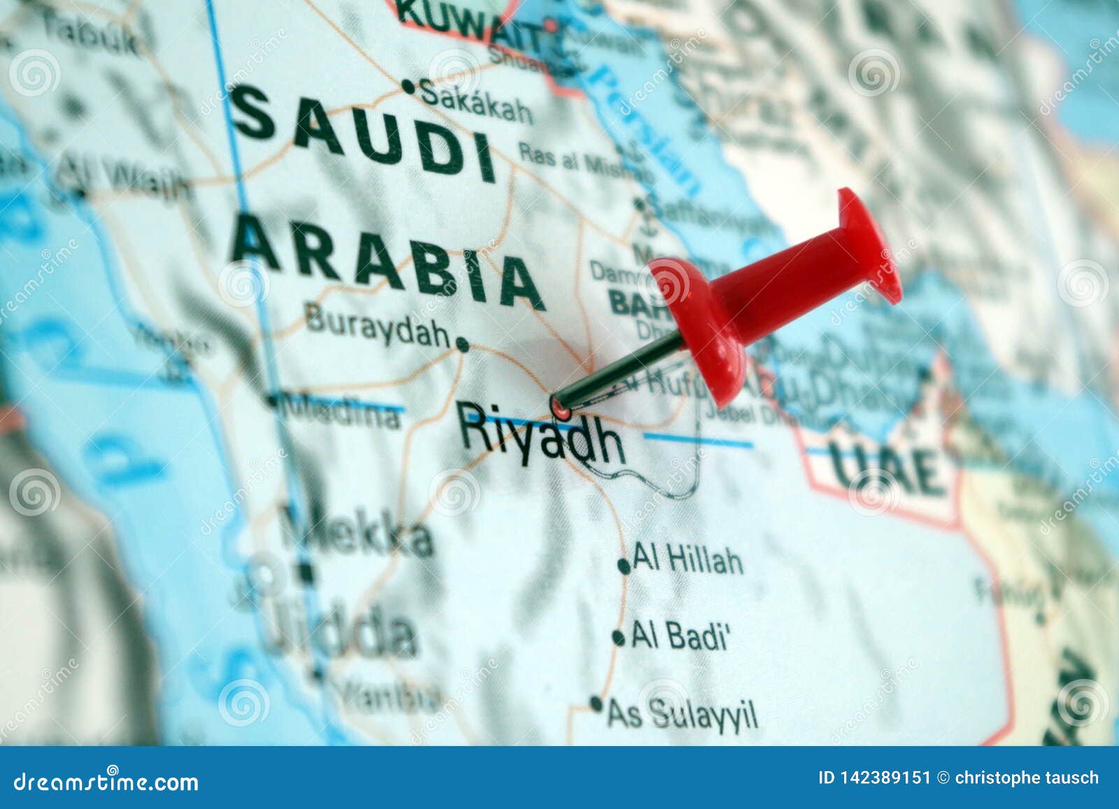 picture of kingdom of saudi arabia on a world map with a red pin on riyadh the capital