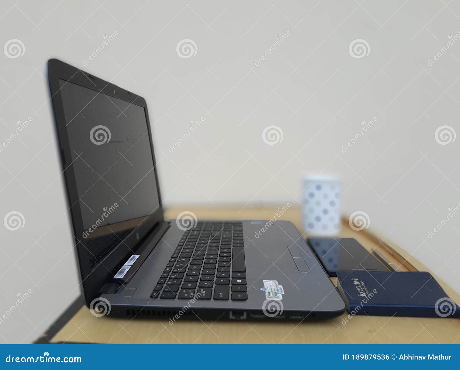 Picture of Laptop and Other Office Related Objects Kept on a Table Editorial Photo Image of
