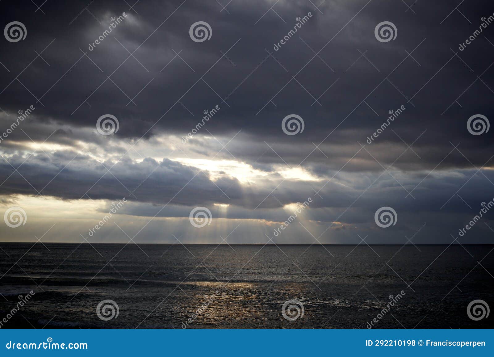 morning light through the spring clouds at the mediterranean sea