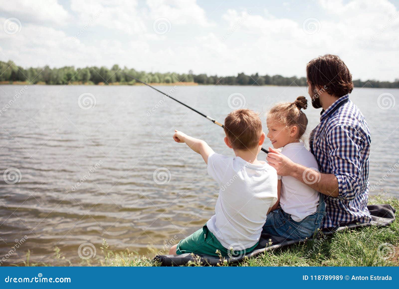 A Picture of Man and His Children Sitting Together on the River Shore. Guy  is Fishing while His Kids are Watching on it Stock Image - Image of child,  horizontal: 118789989