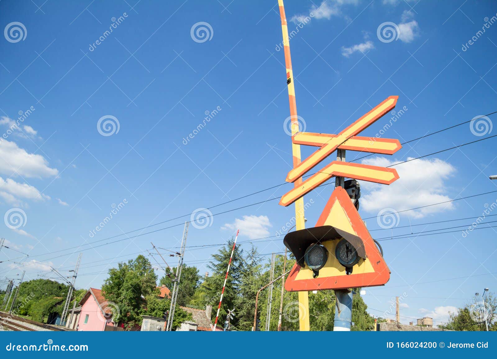 Level Crossing Sign Called Crossbuck Saltire Or Saint Andrews Cross Standing On A Road Which Crosses A Railway Track In Pancevo Stock Photo Image Of Presence Crossroads