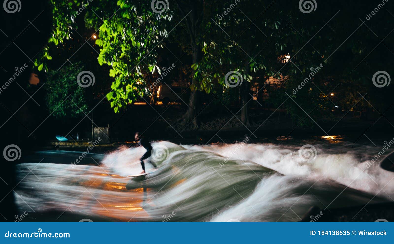 Picture of a Surfer in Motion at Night Under the Lights Stock Image Image of action, rocks