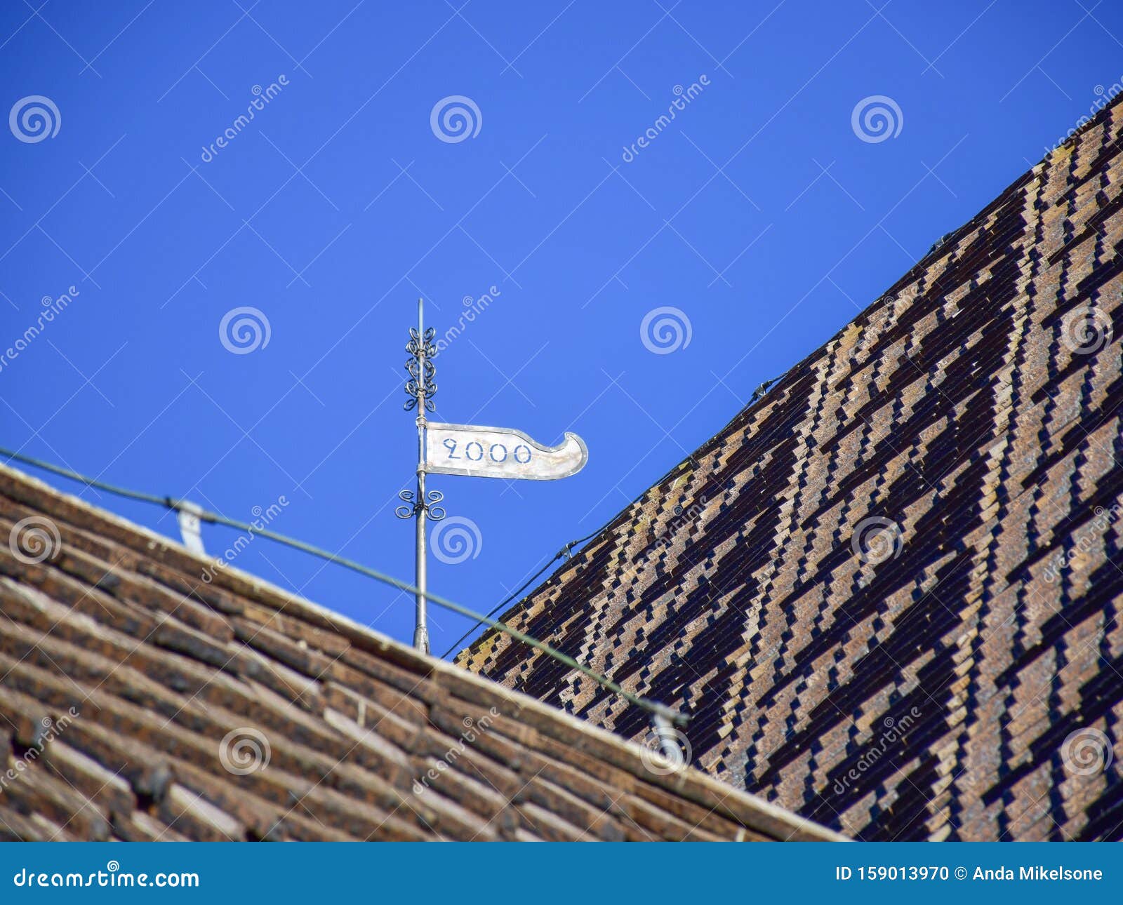 picture of a very old stone house, fragments of wooden tile roof