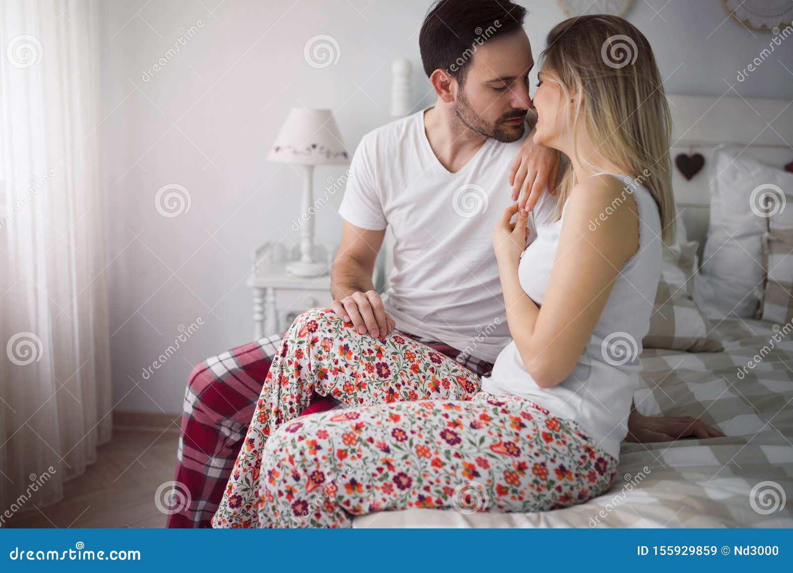 Picture Of Young Attractive Couple Kissing On Bed Stock Image Image Of Attractive Handsome