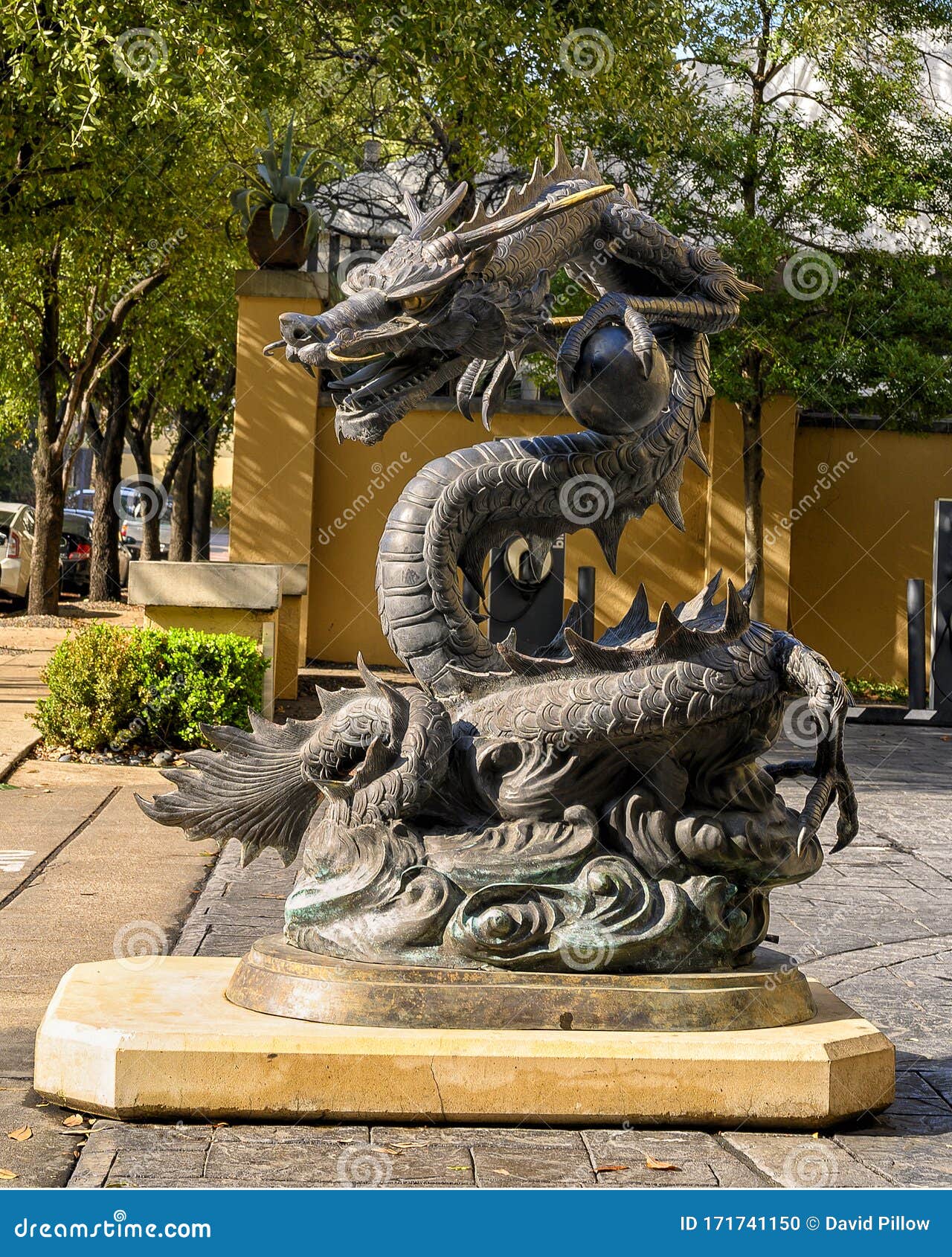 Dragon Sculpture Clutching a Ball in it`s Claw Foot, Located Outside a  Hotel in Dallas, Texas. Stock Photo - Image of dragon, tying: 171741150