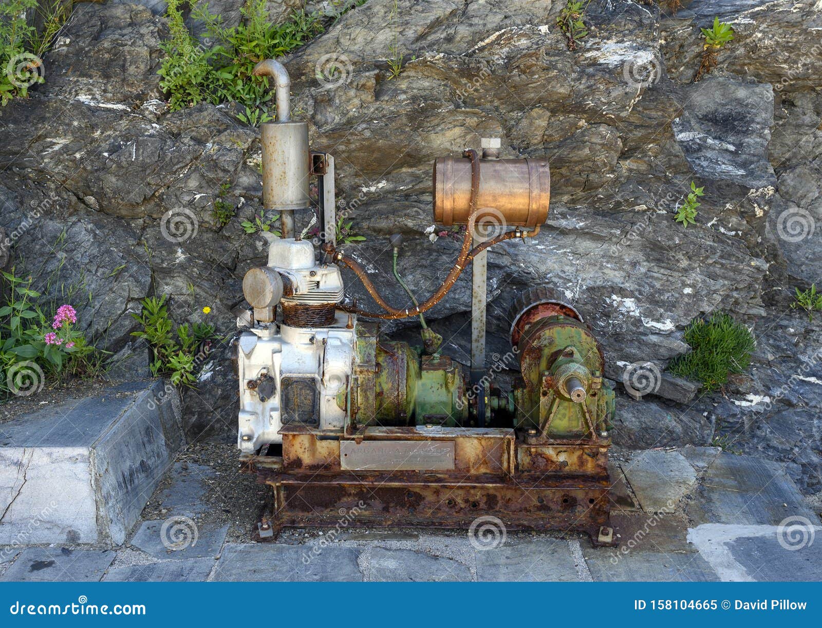 old engine and drive train on display in manarola, the second smallest of the famous cinque terre towns, italy