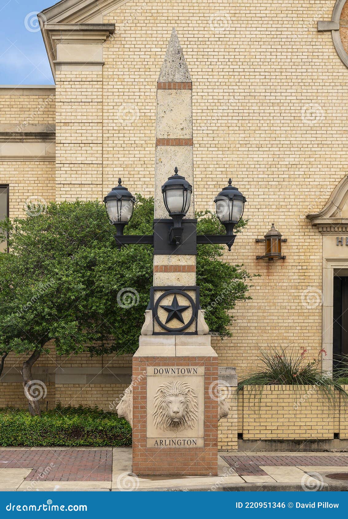 one of two columns marking the entrance to downtown arlington on south center street.