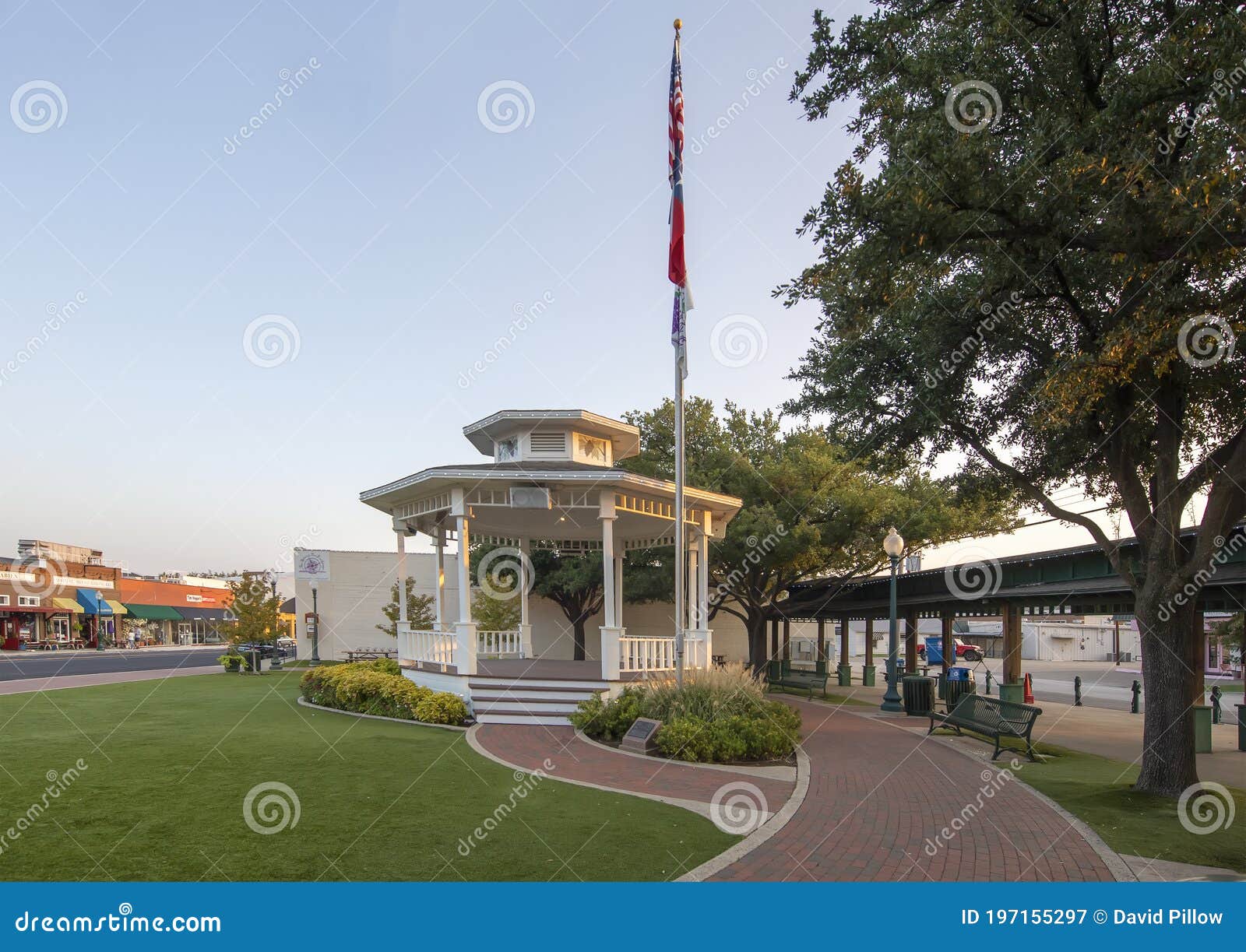 town square gazebo with flagpole in the historic district of grapevine, texas .