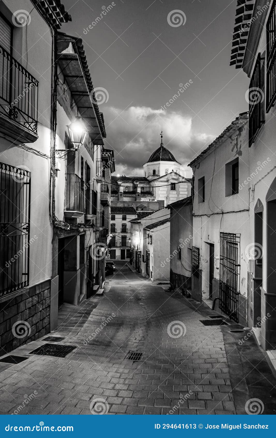 picturesque white village at dusk in andalusia, velez rubio, black and white photo.