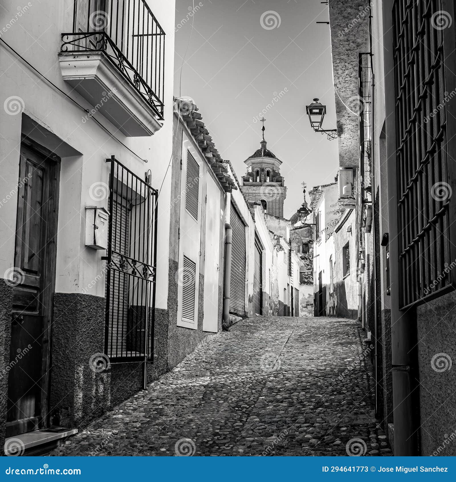 picturesque white village at dusk in andalusia, velez rubio, black and white photo.