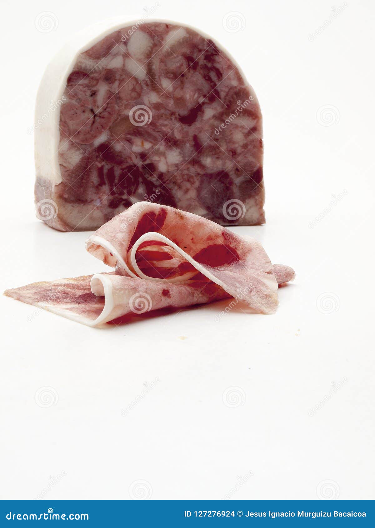 piece of boar head cut into slices on white background viewed from front