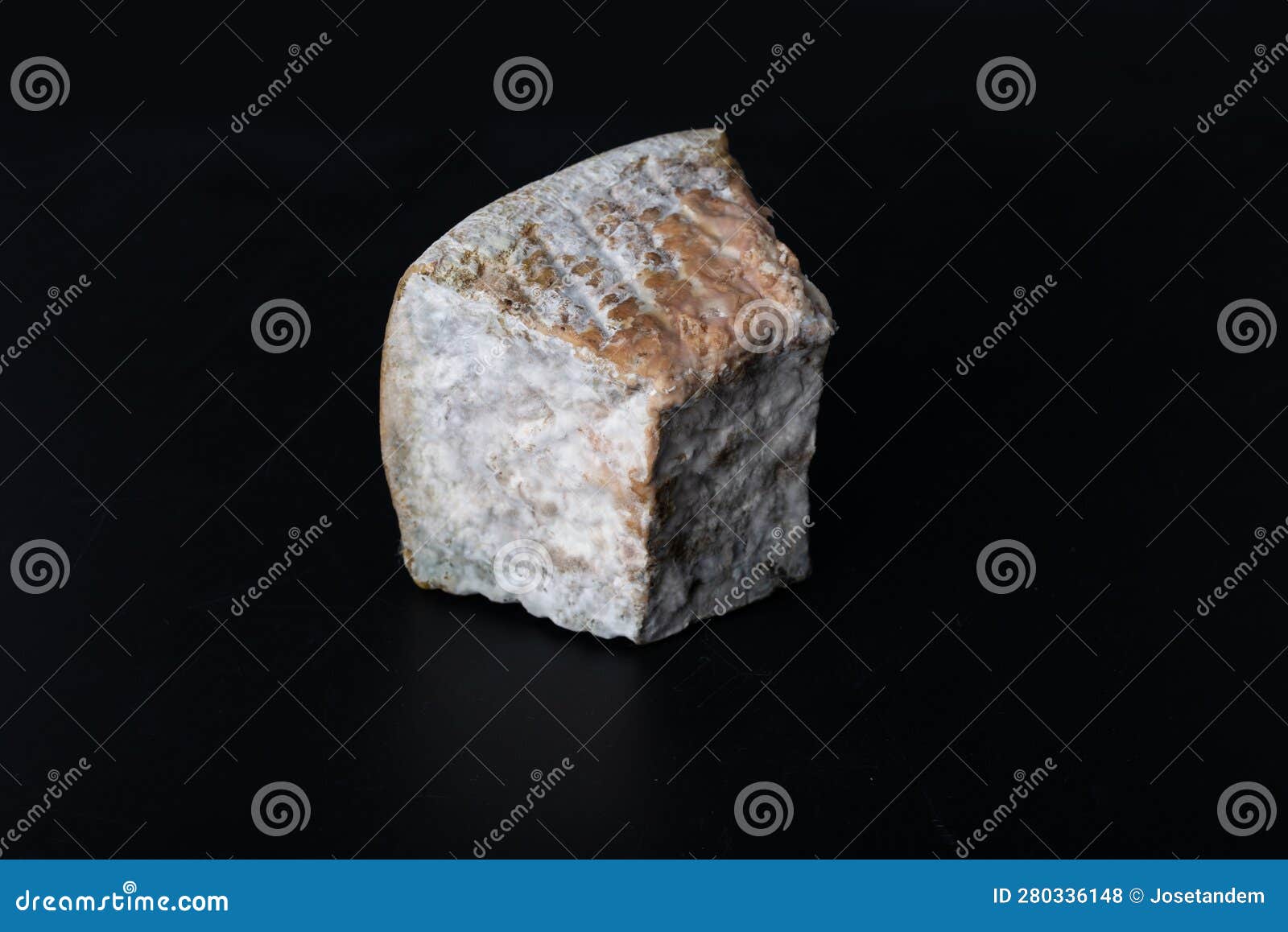 Piece of Cheese Fermented by Bacteria with Fungus and Mold Stock Photo