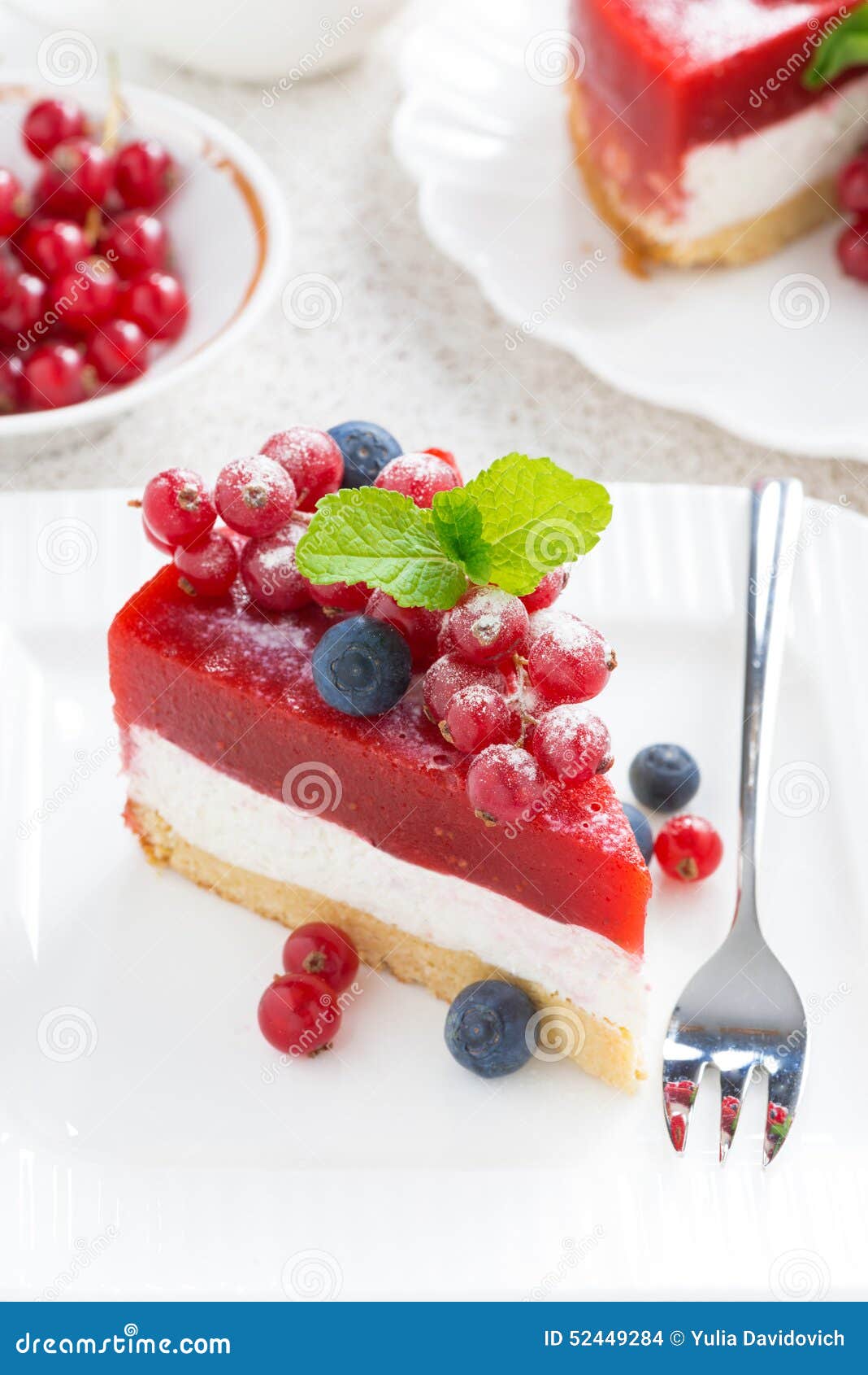 Piece of Cheesecake with Berry Jelly on a White Plate, Top View Stock