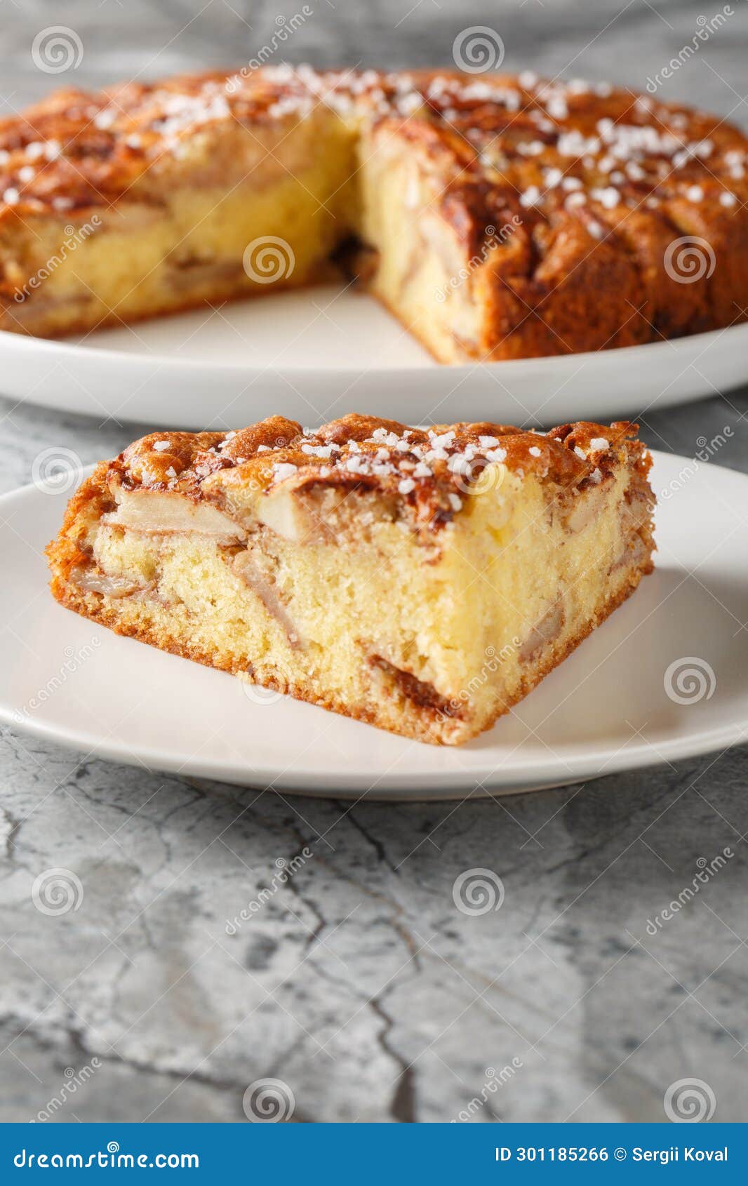 piece of eplekake norwegian apple pie on a plate close-up. vertical