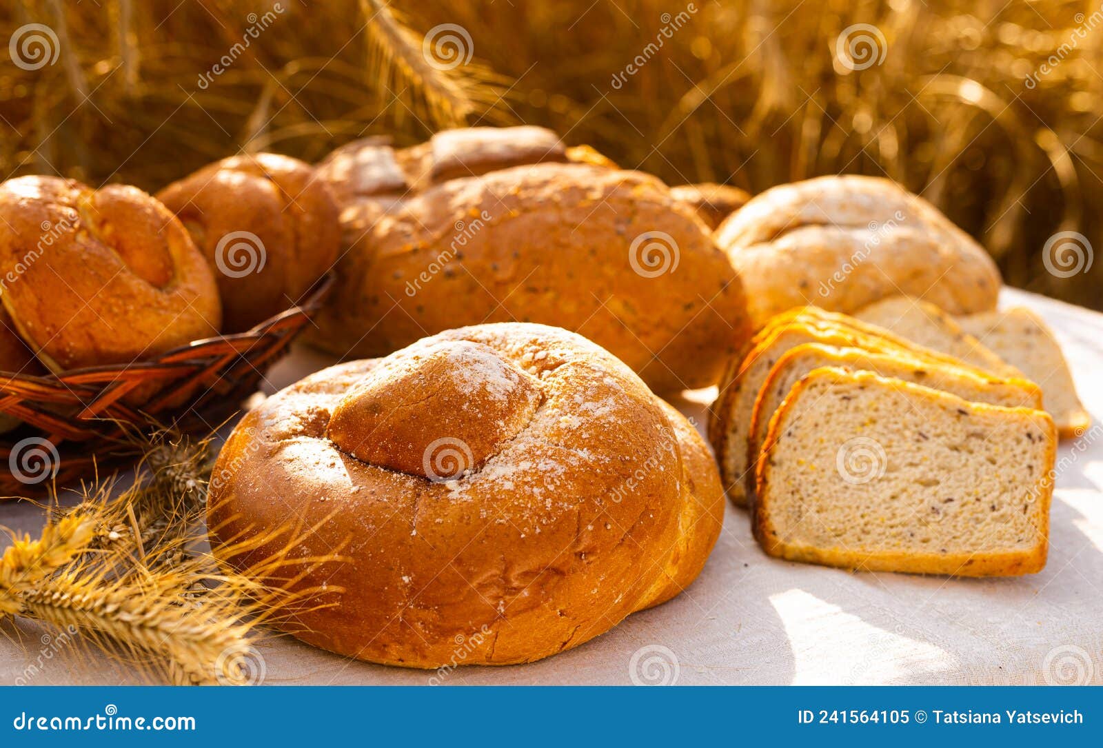 Lot of Different Flavored Bread, Wheat, Rye, on the Table in the Field