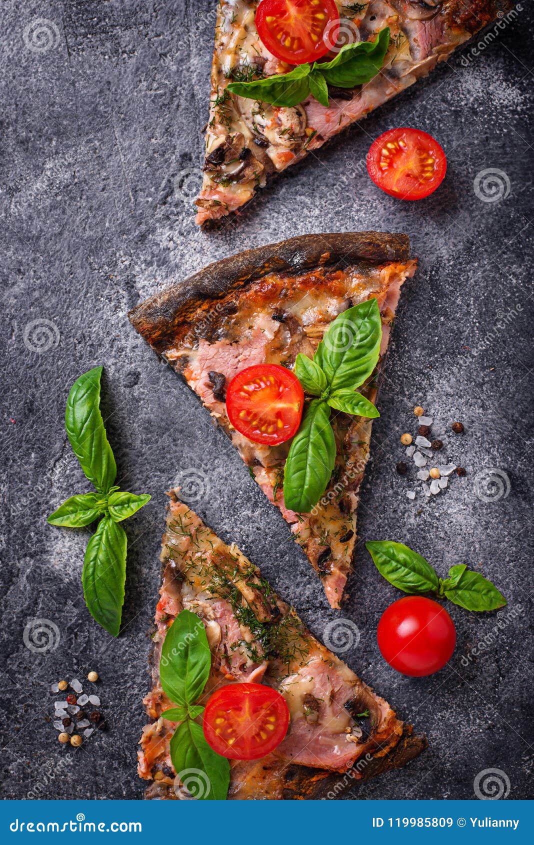 Pieces of Black Pizza with Tomatoes and Basil Stock Image - Image of ...