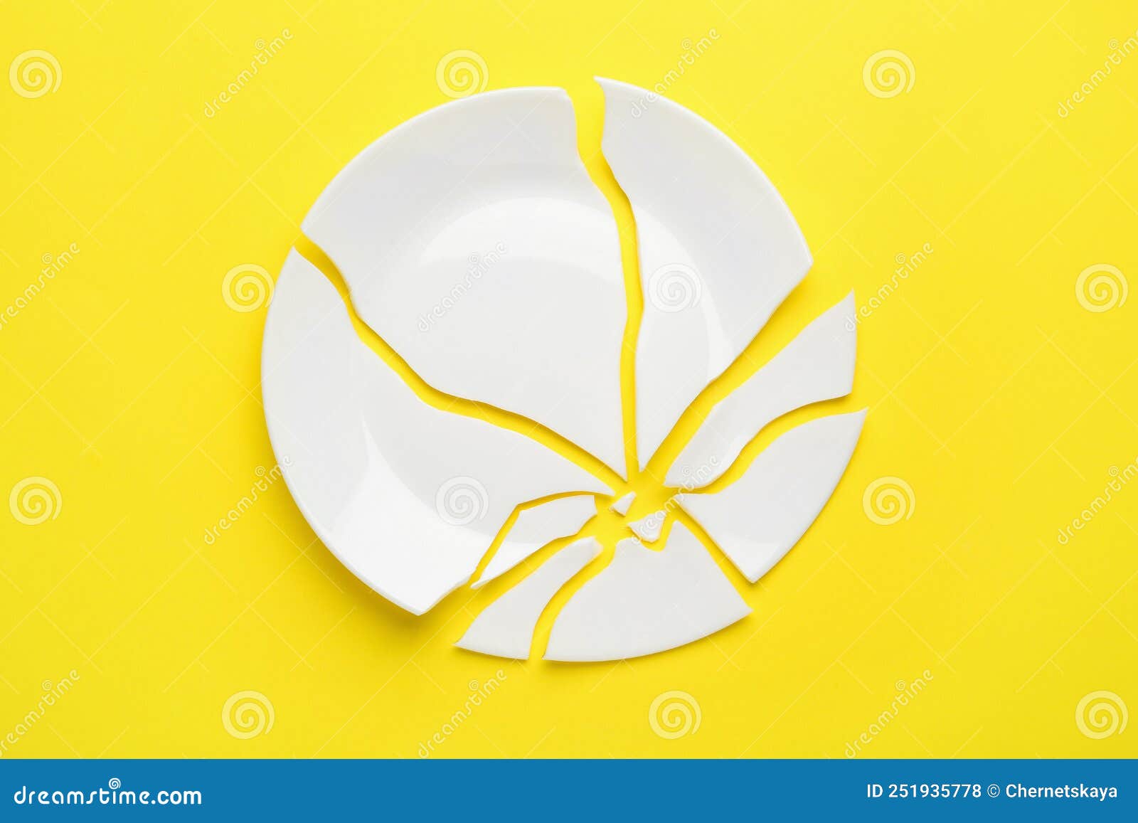 Pieces of Broken Ceramic Plate on Yellow Background, Flat Lay Stock