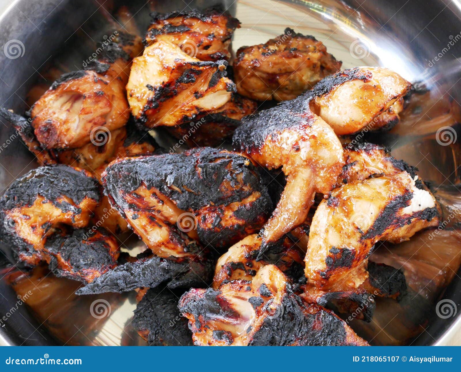 pieces of chicken that have been grilled and ready to serve.