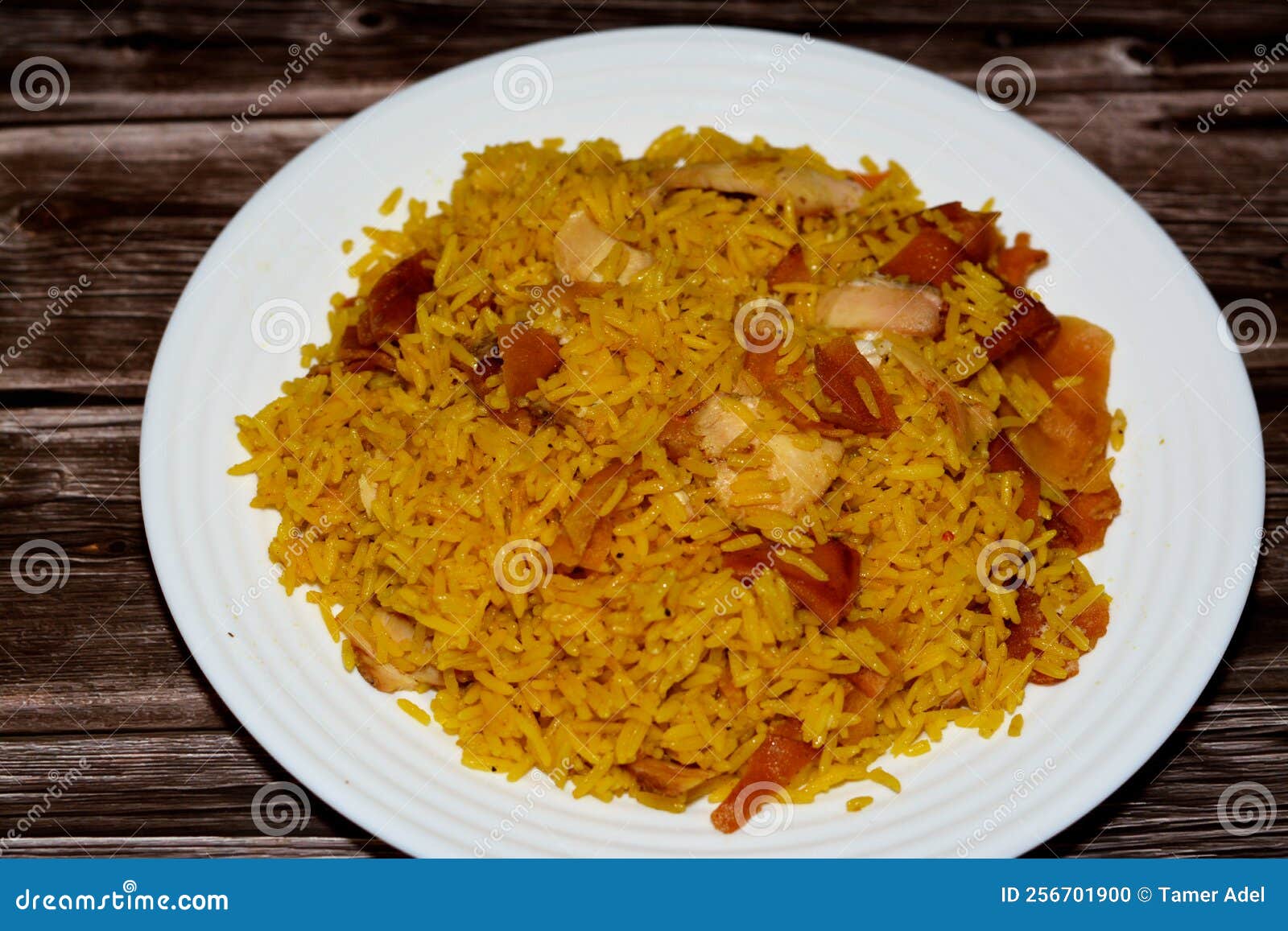 pieces of chicken shawarma with yellow basmati rice, syrian bread and garlic sauce, selective focus of shawerma fattah or fatteh,