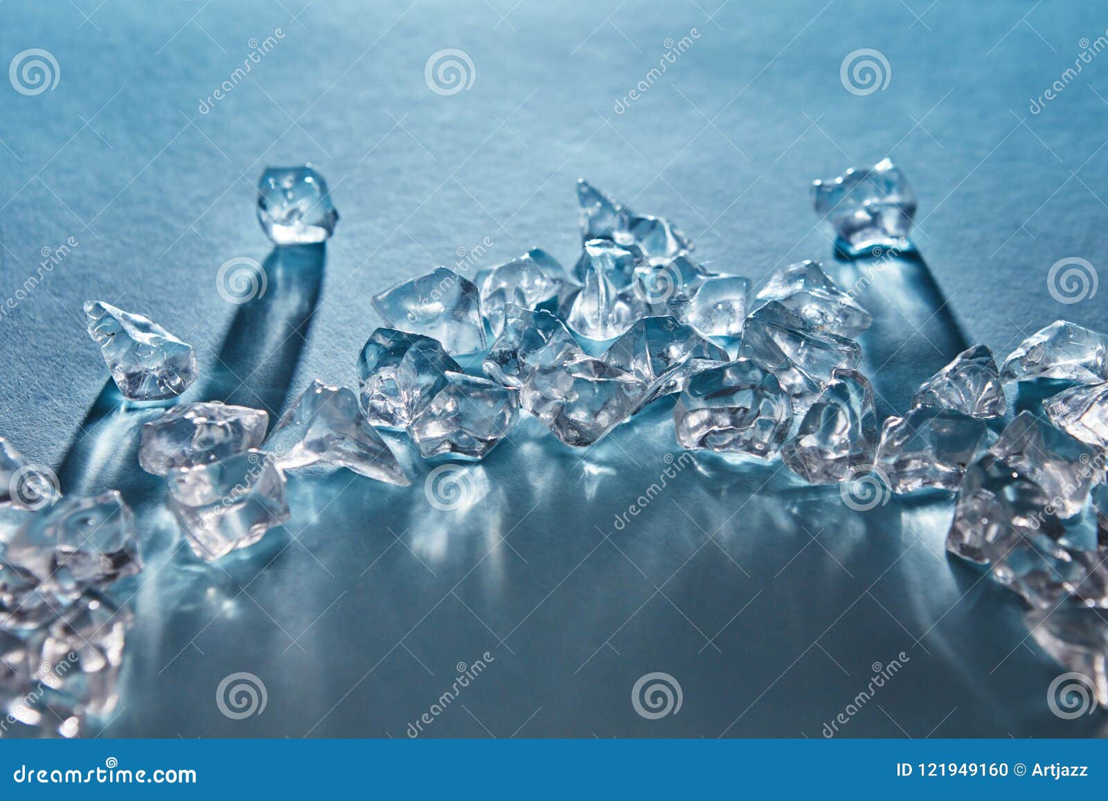 https://thumbs.dreamstime.com/z/pieces-crushed-ice-cubes-form-arc-long-shadows-reflections-surface-blue-long-shadows-121949160.jpg