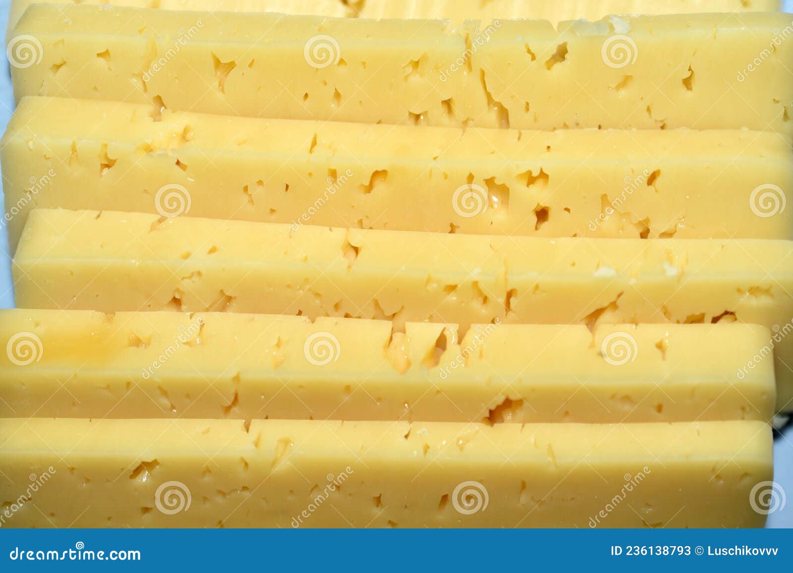 pieces of juicy cheese cut on a cutting board