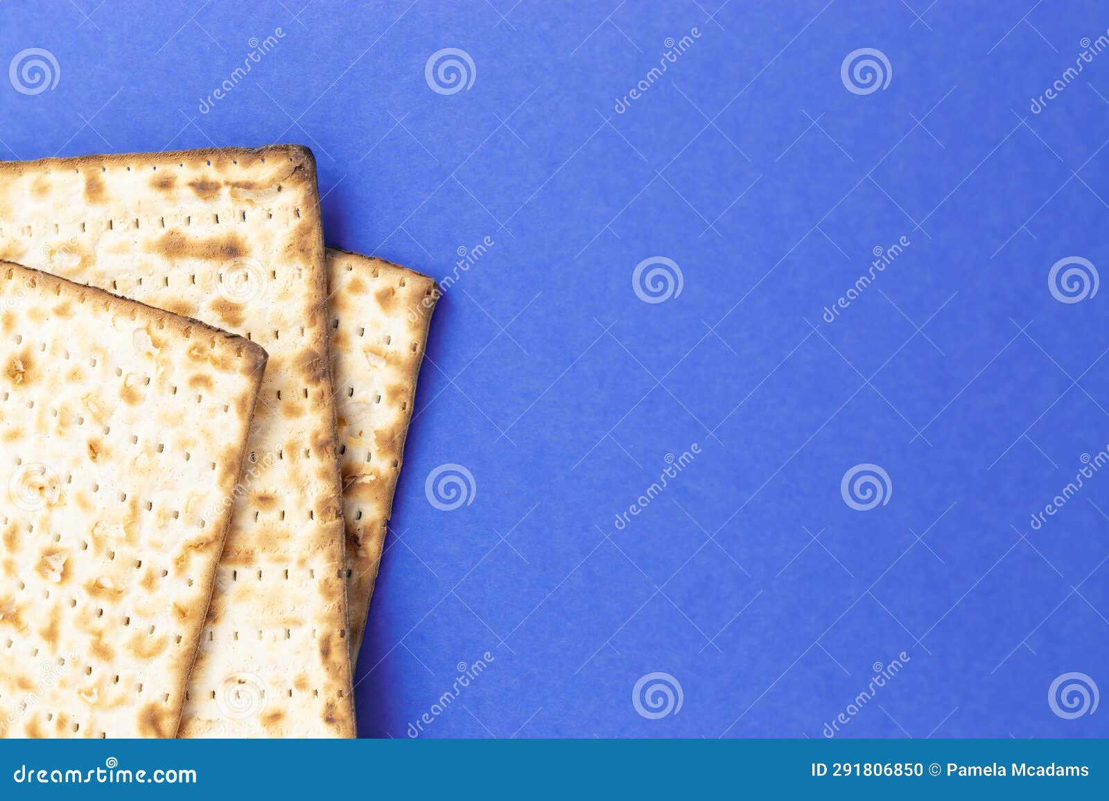 Pieces of Matzah Bread Unleavened Bread on a Blue Background Stock