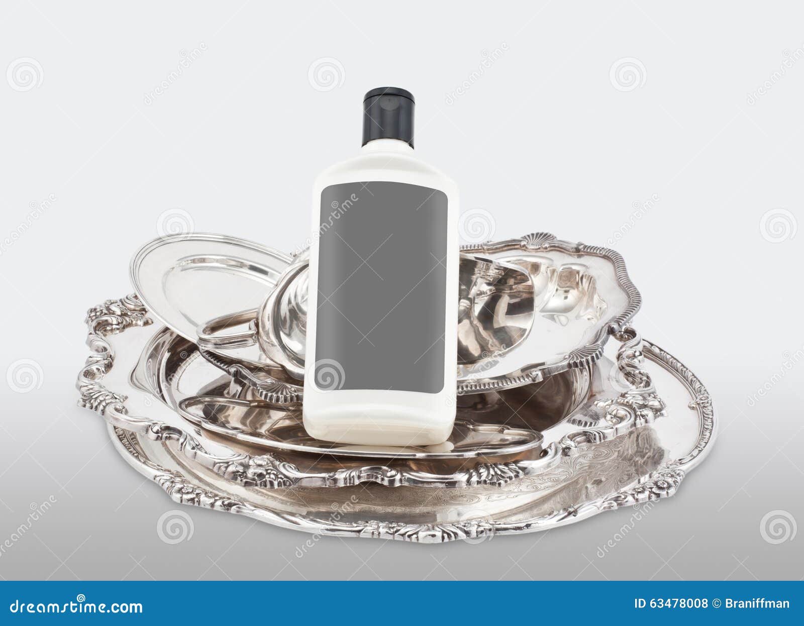 Pieces of Silver and a Bottle of Polishing Product Stock Photo Image