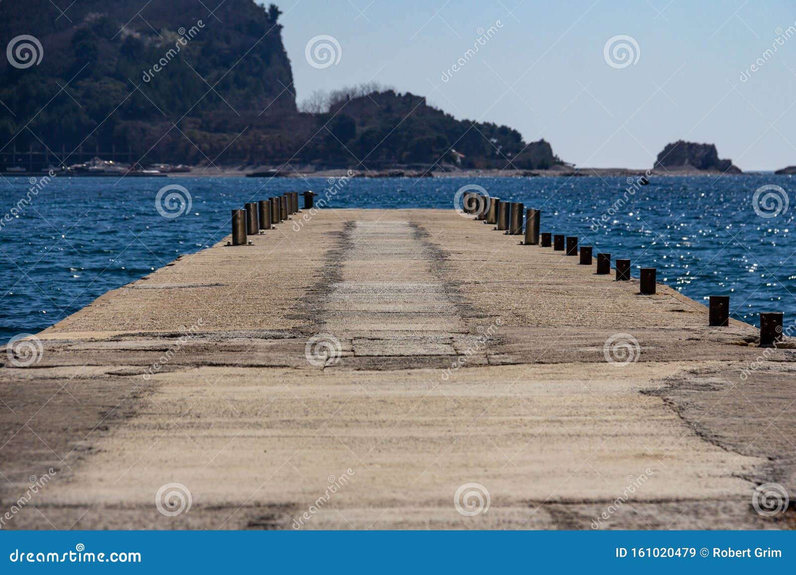 Pier on Beach Greco, Budva, Montenegro Leading To Saint Nikola Island ...