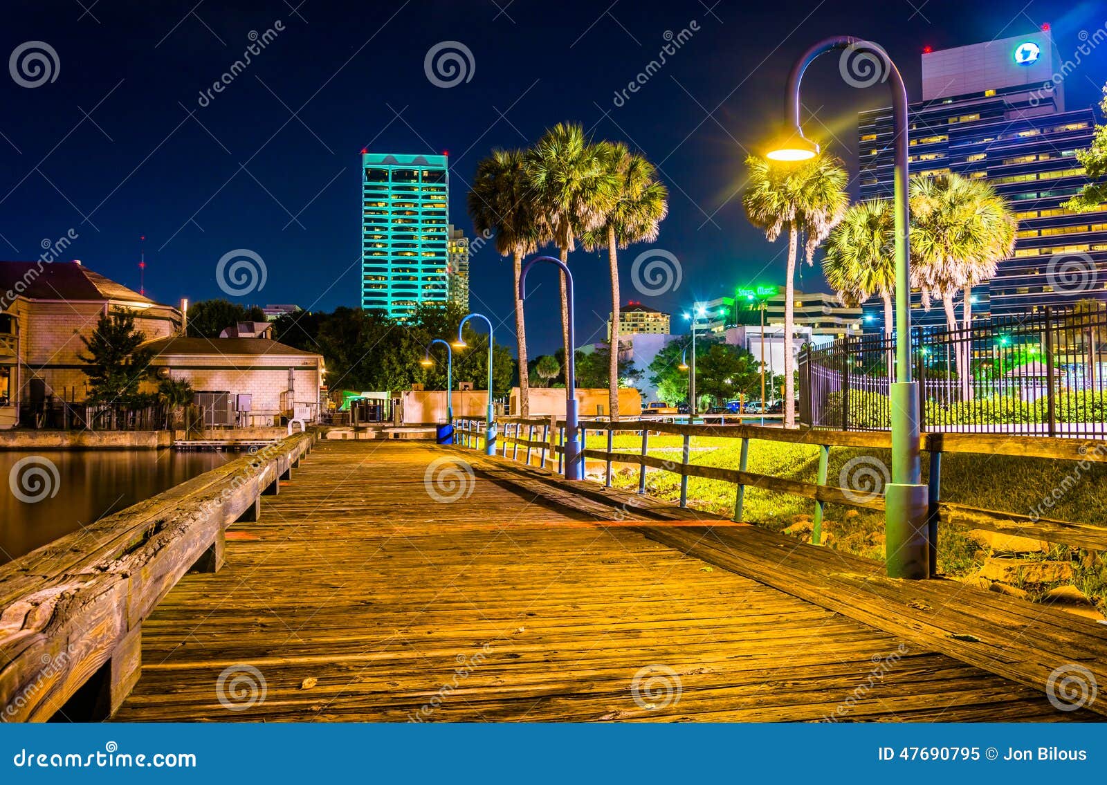Pier and Buildings at Night in Jacksonville, Florida. Editorial Image