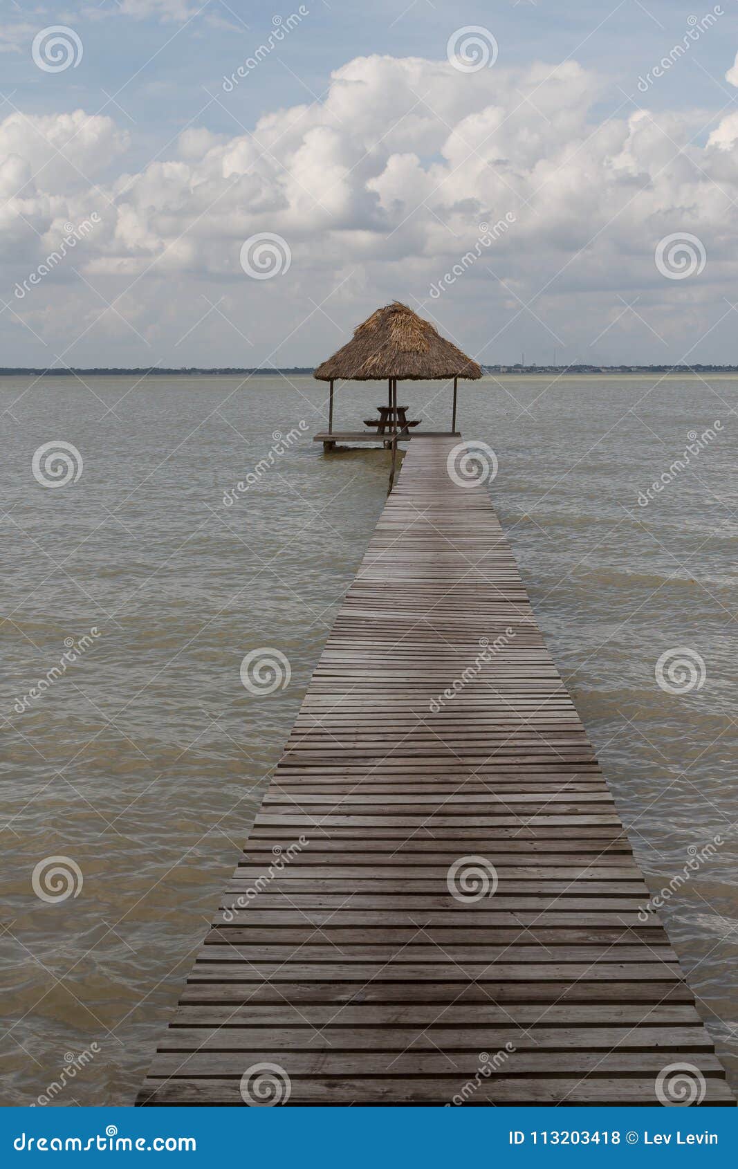 pier near ruins of the ancient mayan archaeological site cerros