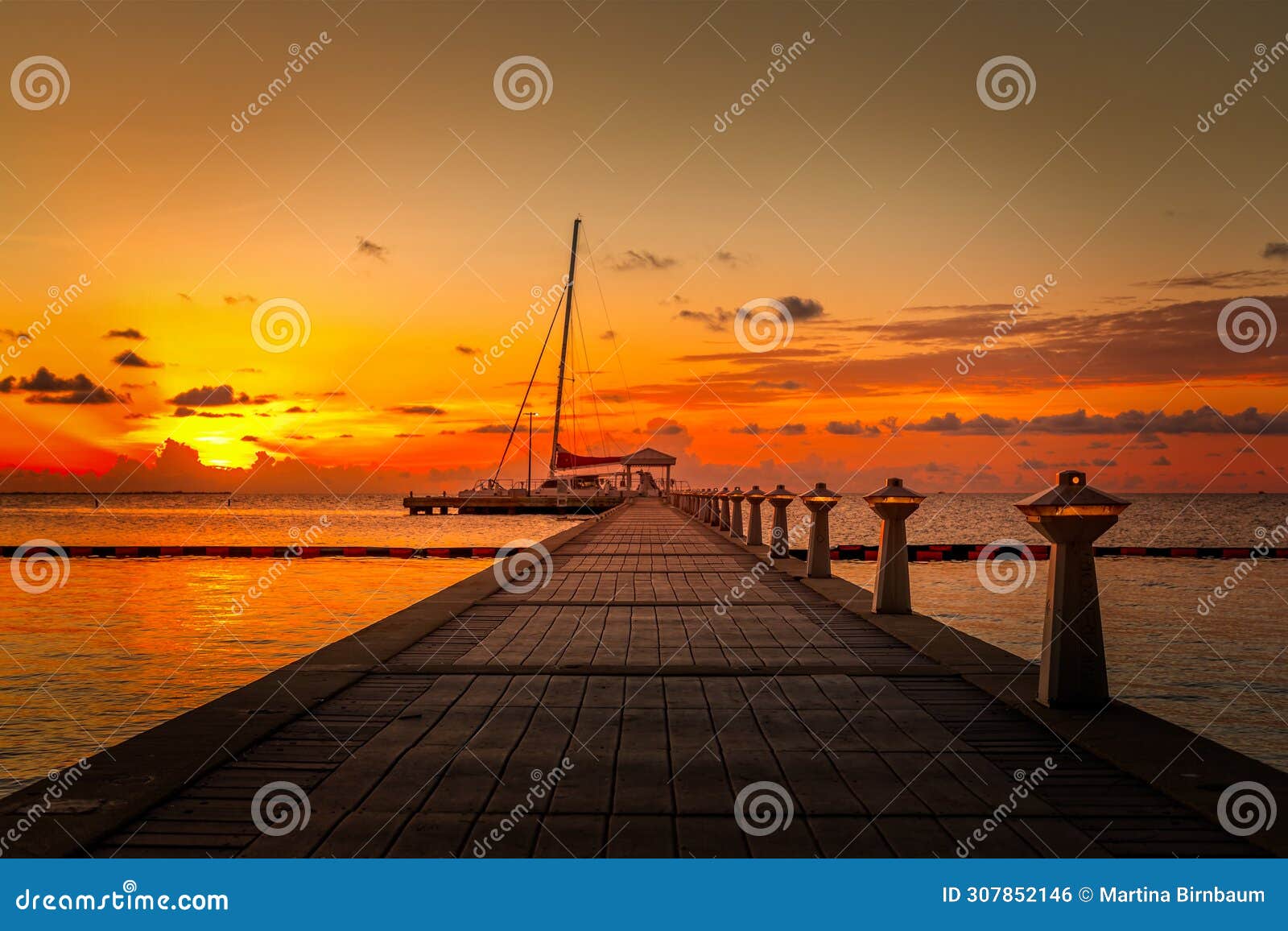 The Pier Towards the Horizon at Sunset on Grand Cayman Stock Photo - Image  of cloudy, cayman: 307852146