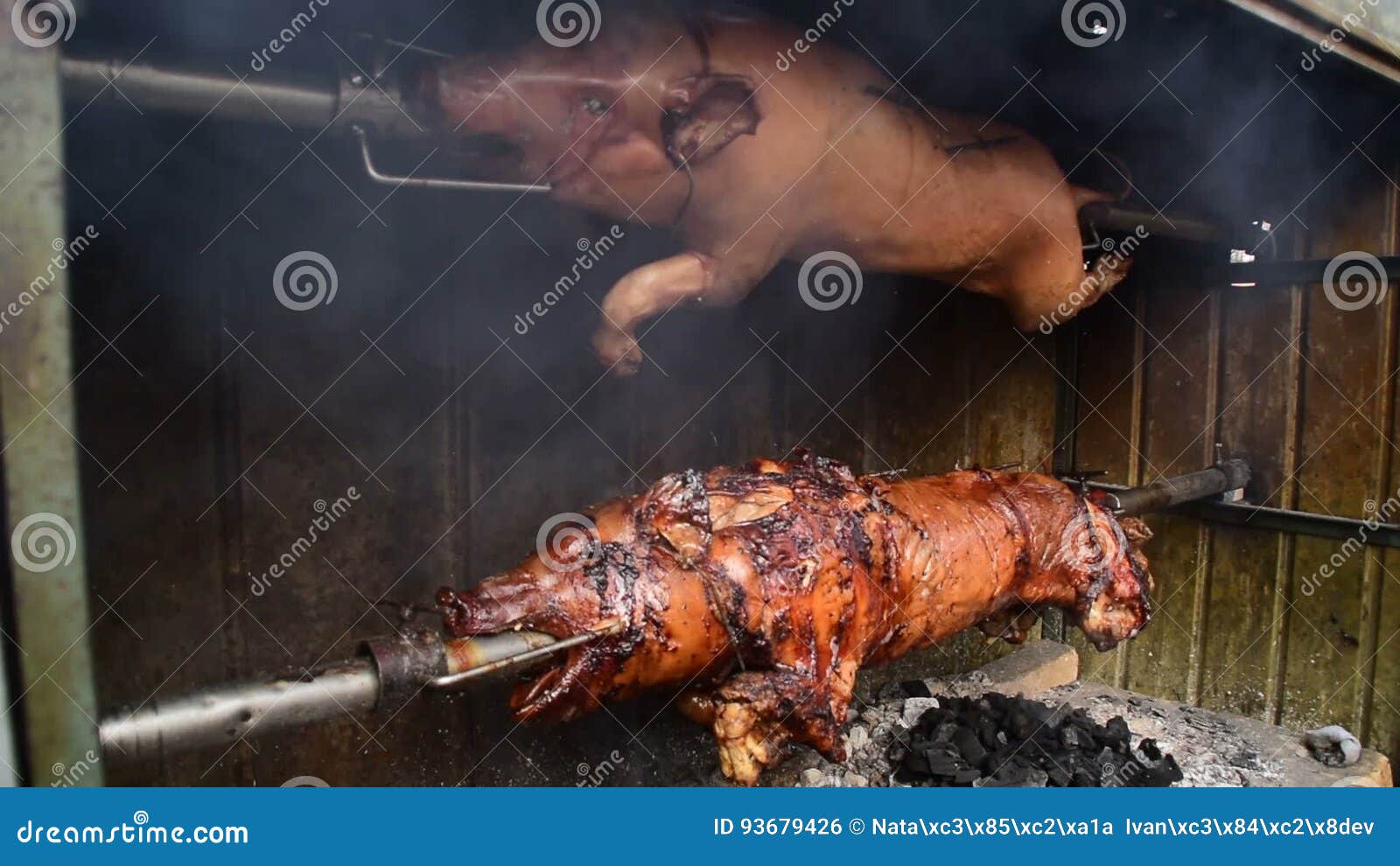 Pig Is Roasting On A Spit Roasting Pig Is Prepared For