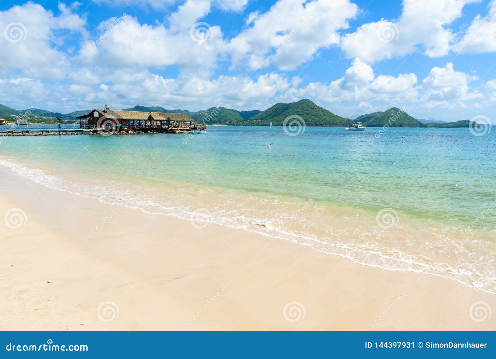 pigeon island beach - tropical coast on the caribbean island of st. lucia. it is a paradise destination with a white sand beach
