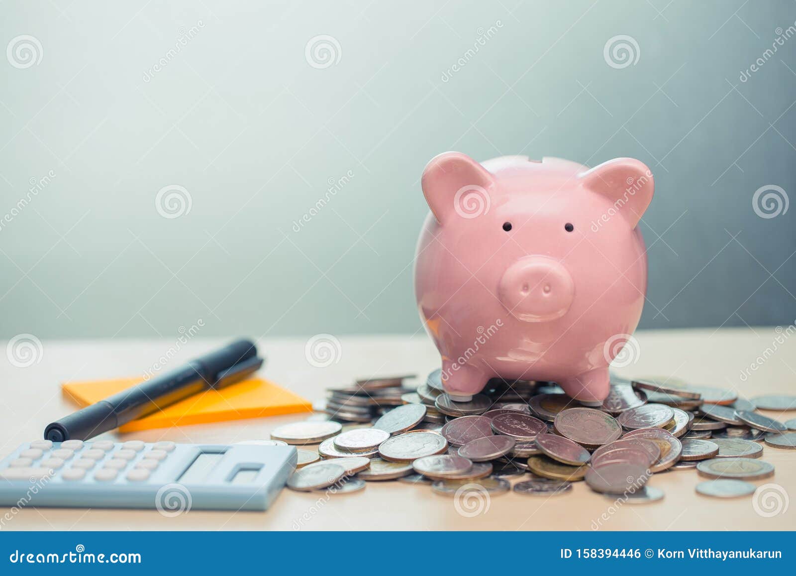 piggy bank with coin note paper and calculator for personal account money saving concept