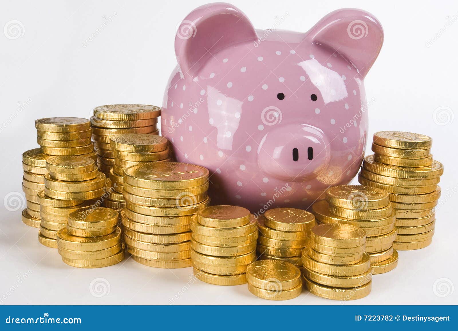 Piggy Bank and Money. Stacks of golden wrapped chocolate money surrounding a pink piggy bank