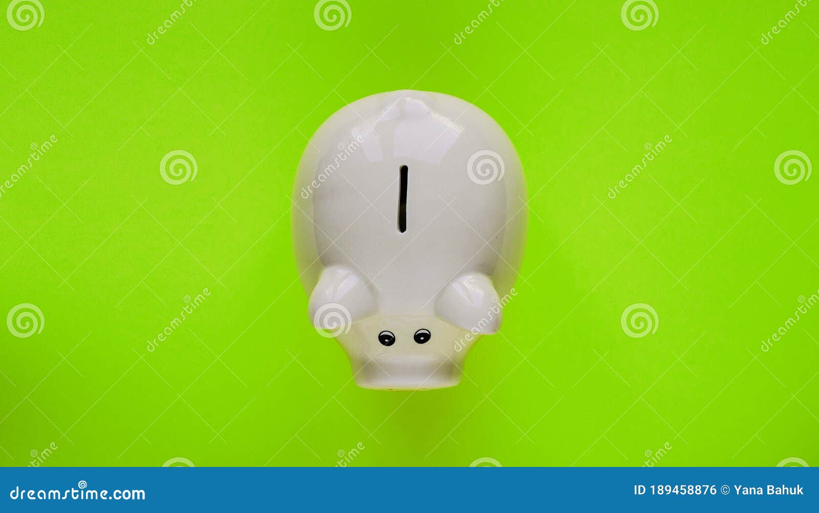 a piggy bank saving and investment theme on a green paper background